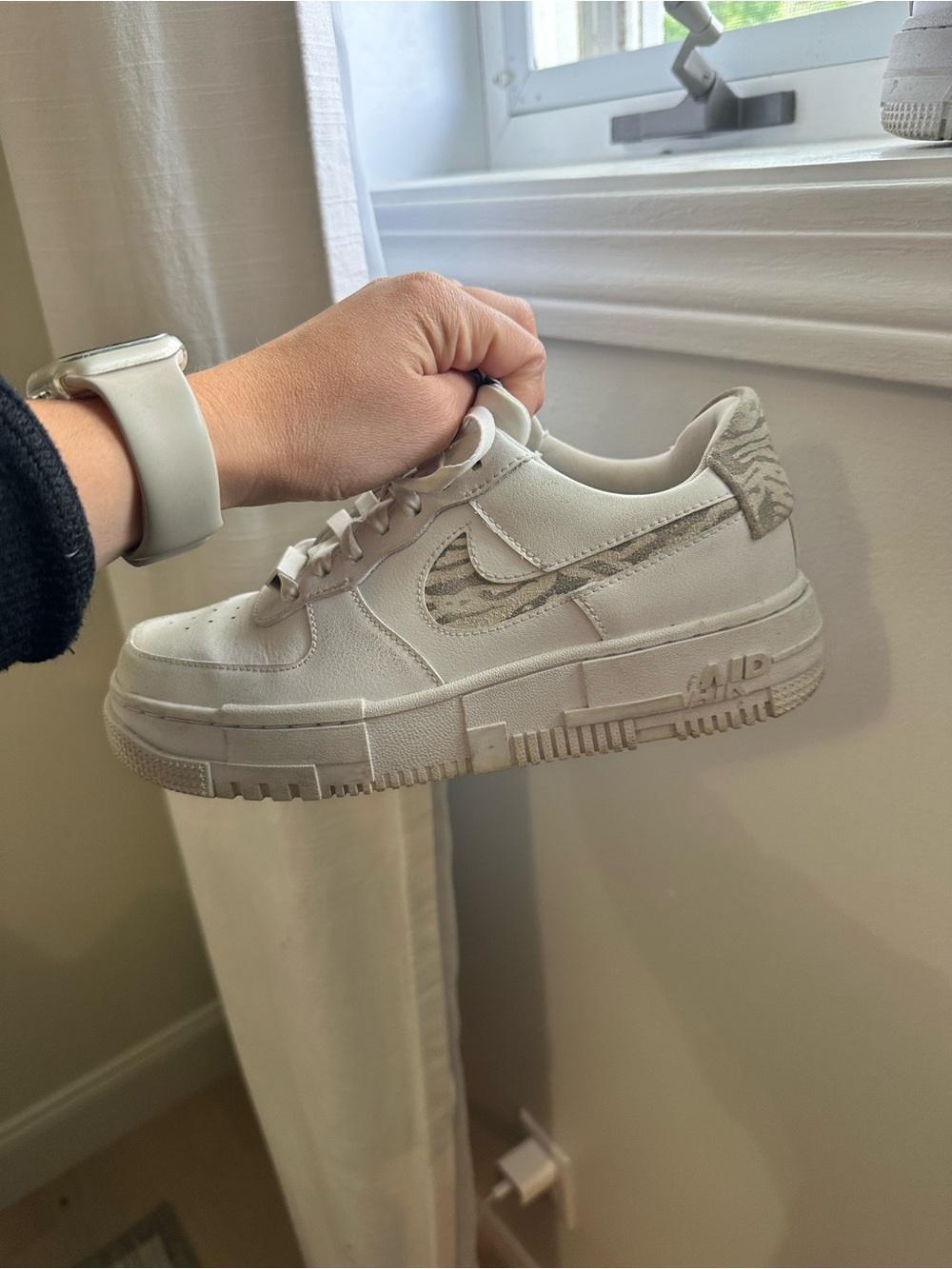 Nike White Low-Top Sneakers with Beige Patterned Swoosh